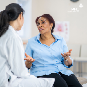 A Hispanic woman in her early 70's talks with her physician.