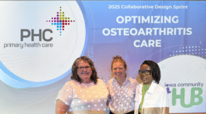 Teresa Fisher, Lashelle Goode, and Rachelle Scott Oakley stand in front of a presentation screen that reads 