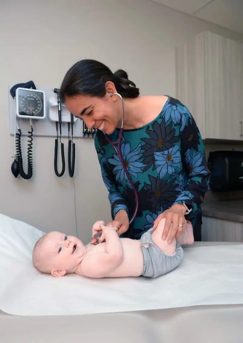 Dr. Heidi Shreck examines a baby at PHC